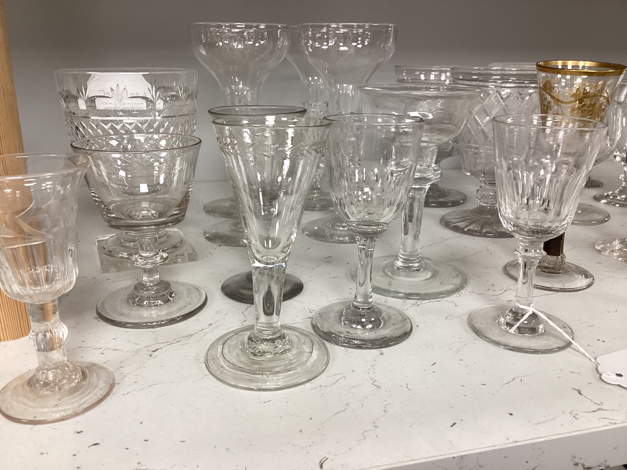 A quantity of assorted 18th / 19th century and later clear drinking glasses including a damaged James Giles gilt decorated opaque twist stem wine glass.